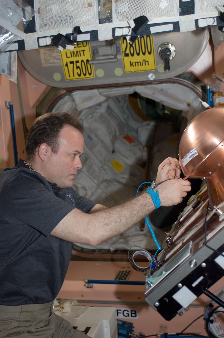 ISS028-E-008463 (19 June 2011) --- In the Unity node of the International Space Station, NASA astronaut Ron Garan, Expedition 28 flight engineer, prepares the Reentry Breakup Recorder (REBR) for installation in the Automated Transfer Vehicle-2 (ATV-2). The ATV-2 is scheduled to undock from the station on June 20, 2011. REBR data improves the understanding of vehicle breakup during reentry, allowing improvements in prediction of the breakup process, increasing the accuracy of estimated casualty expectations, and limiting premature deorbiting of space hardware. In the long term, this research assists in the development of a "black box" for commercial space transportation systems.