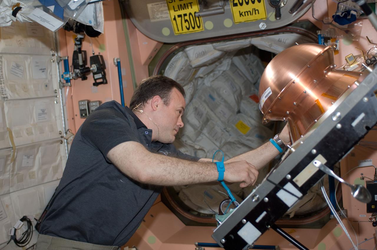 ISS028-E-008467 (19 June 2011) --- In the Unity node of the International Space Station, NASA astronaut Ron Garan, Expedition 28 flight engineer, prepares the Reentry Breakup Recorder (REBR) for installation in the Automated Transfer Vehicle-2 (ATV-2). The ATV-2 is scheduled to undock from the station on June 20, 2011. REBR data improves the understanding of vehicle breakup during reentry, allowing improvements in prediction of the breakup process, increasing the accuracy of estimated casualty expectations, and limiting premature deorbiting of space hardware. In the long term, this research assists in the development of a "black box" for commercial space transportation systems.