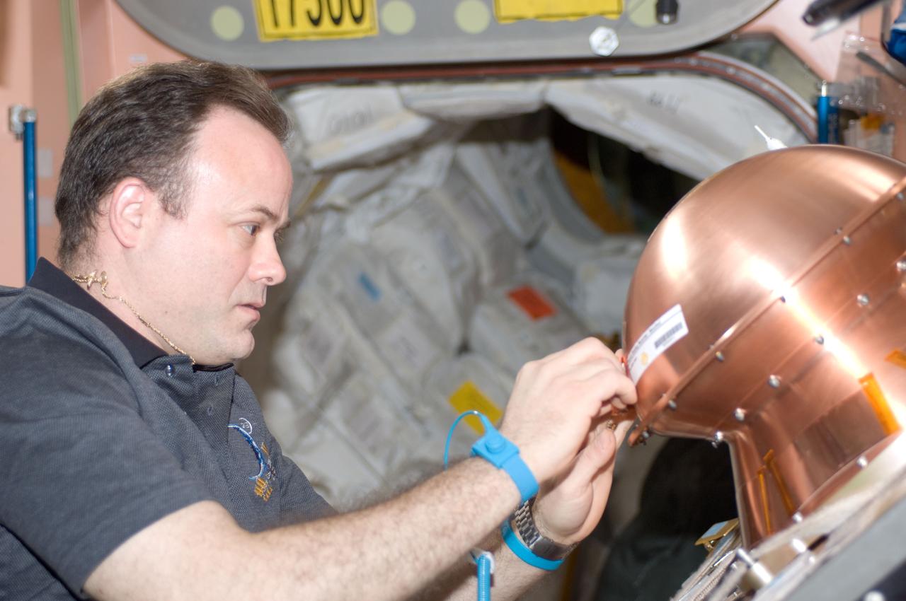 ISS028-E-008470 (19 June 2011) --- In the Unity node of the International Space Station, NASA astronaut Ron Garan, Expedition 28 flight engineer, prepares the Reentry Breakup Recorder (REBR) for installation in the Automated Transfer Vehicle-2 (ATV-2). The ATV-2 is scheduled to undock from the station on June 20, 2011. REBR data improves the understanding of vehicle breakup during reentry, allowing improvements in prediction of the breakup process, increasing the accuracy of estimated casualty expectations, and limiting premature deorbiting of space hardware. In the long term, this research assists in the development of a "black box" for commercial space transportation systems.