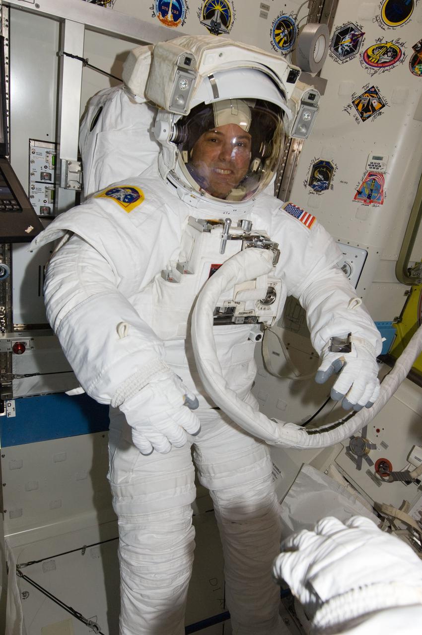 ISS028-E-009217 (22 June 2011) --- NASA astronaut Ron Garan, attired in his Extravehicular Mobility Unit (EMU) spacesuit, is pictured in the Quest airlock of the International Space Station. Garan and NASA astronaut Mike Fossum (out of frame), both Expedition 28 flight engineers, were participating in a ?dry run? in preparation for a planned spacewalk during STS-135/ULF-7.
