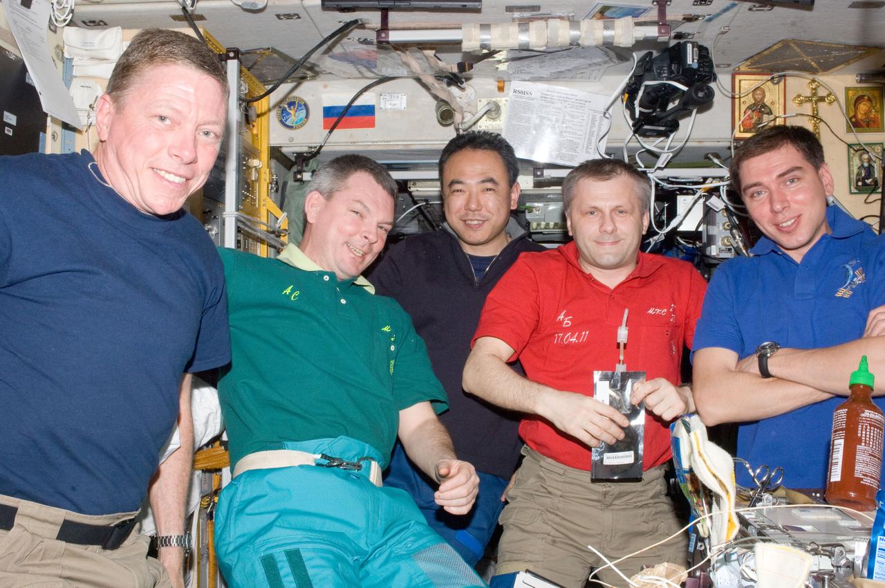ISS028-E-009699 (25 June 2011) --- Five of the six Expedition 28 crew members currently onboard the International Space Station are pictured in the Zvezda Service Module. From the left are NASA astronaut Mike Fossum, Russian cosmonaut Alexander Samokutyaev, Japan Aerospace Exploration Agency astronaut Satoshi Furukawa, all flight engineers; Russian cosmonaut Andrey Borisenko, commander; and Russian cosmonaut Sergei Volkov, flight engineer.