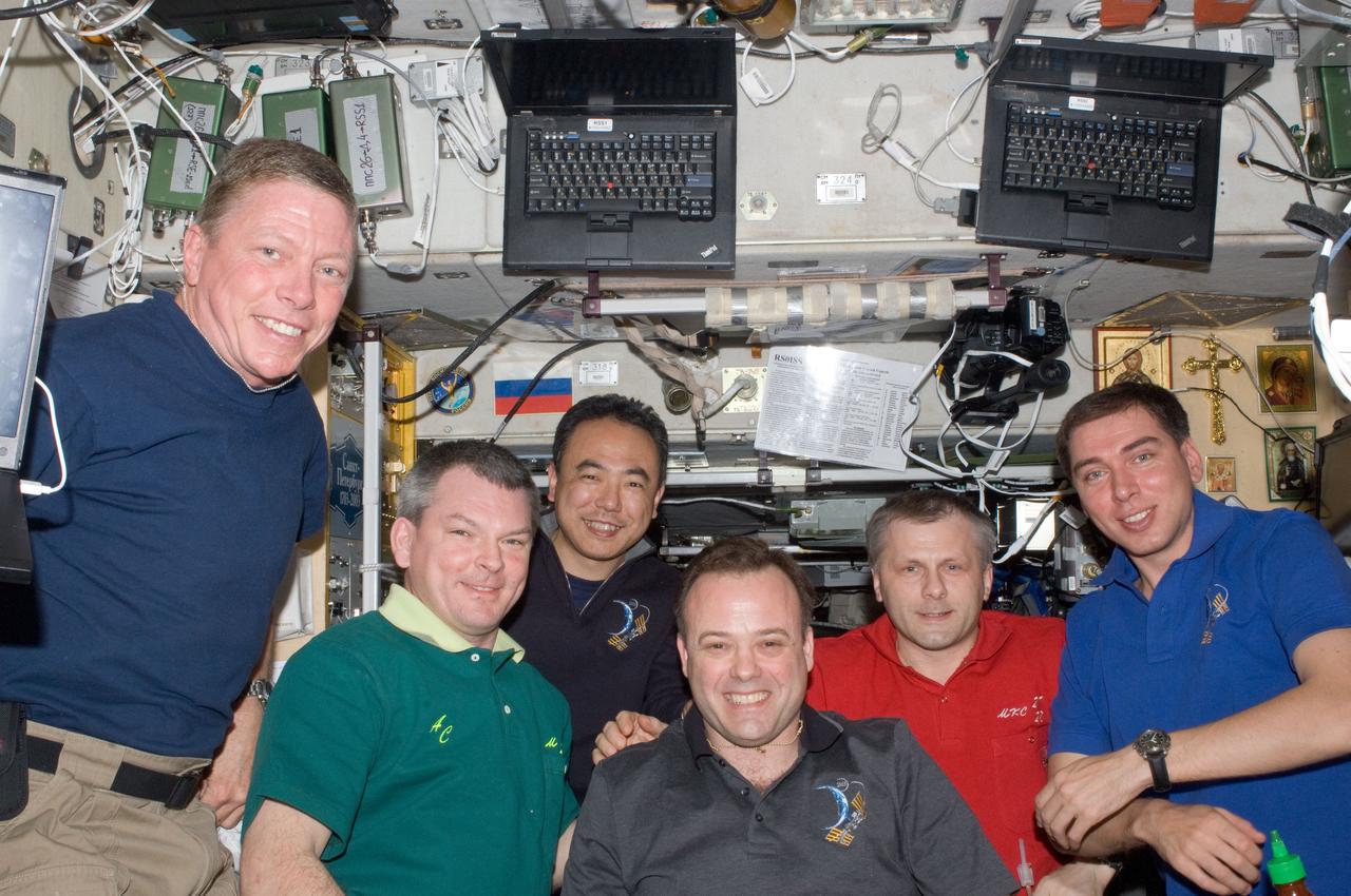 ISS028-E-009701 (25 June 2011) --- Expedition 28 crew members pose for a photo in the Zvezda Service Module of the International Space Station. Pictured from the left are NASA astronaut Mike Fossum, Russian cosmonaut Alexander Samokutyaev, Japan Aerospace Exploration Agency astronaut Satoshi Furukawa, NASA astronaut Ron Garan, all flight engineers; Russian cosmonaut Andrey Borisenko, commander; and Russian cosmonaut Sergei Volkov, flight engineer.