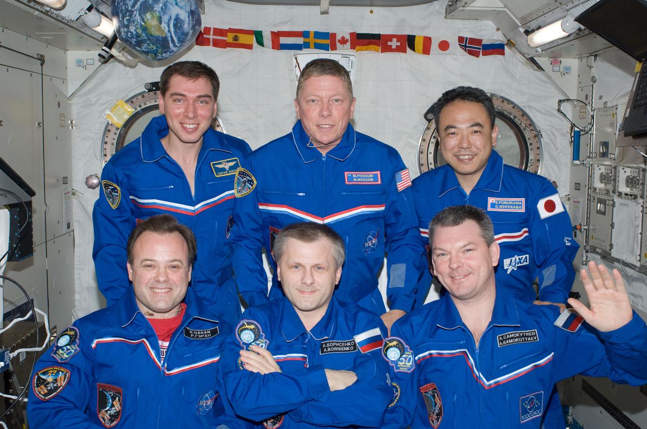 ISS028-E-009725 (24 June 2011) --- Expedition 28 crew members pose for an in-flight crew portrait in the Kibo laboratory of the International Space Station. Pictured on the front row are Russian cosmonaut Andrey Borisenko (center), commander; along with NASA astronaut Ron Garan (left) and Russian cosmonaut Alexander Samokutyaev, both flight engineers. Pictured from the left (back row) are Russian cosmonaut Sergei Volkov, NASA astronaut Mike Fossum and Japan Aerospace Exploration Agency astronaut Satoshi Furukawa, all flight engineers.