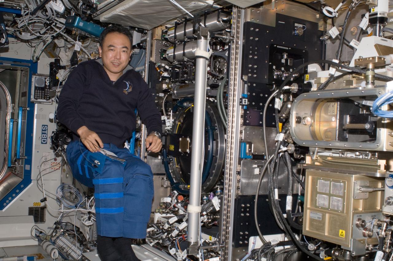 ISS028-E-013344 (26 June 2011) --- Japan Aerospace Exploration Agency astronaut Satoshi Furukawa, Expedition 28 flight engineer, is pictured near the Combustion Integrated Rack (CIR) Multi-user Drop Combustion Apparatus (MDCA) in the Destiny laboratory of the International Space Station.