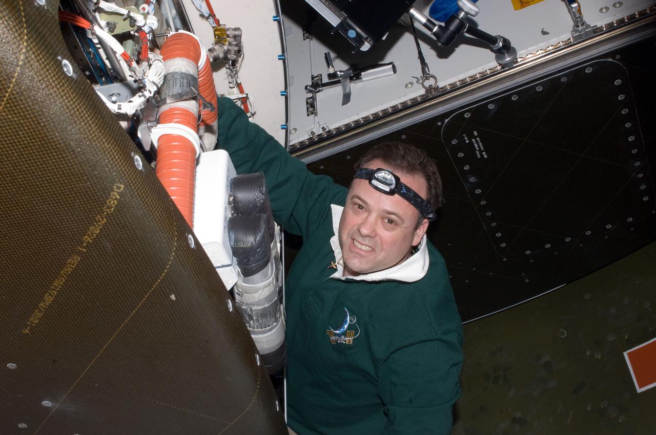 ISS028-E-014395 (6 July 2011) --- NASA astronaut Ron Garan, Expedition 28 flight engineer, performs in-flight maintenance on the Mass Constituents Analyzer (MCA) in the Destiny laboratory of the International Space Station.