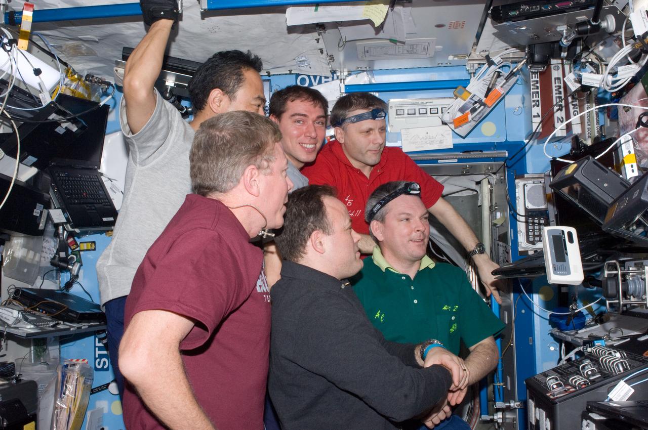 ISS028-E-014701 (8 July 2011) --- Expedition 28 crew members watch the launch of STS-135 space shuttle Atlantis from a computer in the Destiny laboratory of the International Space Station. Pictured counter-clockwise (from top right) are Russian cosmonaut Andrey Borisenko, commander; Russian cosmonaut Sergei Volkov, Japan Aerospace Exploration Agency astronaut Satoshi Furukawa, NASA astronauts Mike Fossum and Ron Garan, and Russian cosmonaut Alexander Samokutyaev, all flight engineers.