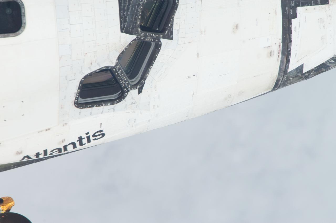 ISS028-E-015117 (10 July 2011) --- This is one of a series of images showing various parts of the space shuttle Atlantis in Earth orbit as photographed by one of the six crewmembers on the International Space Station as the shuttle “posed” for photo and visual surveys and performed a back-flip for the rendezvous pitch maneuver (RPM). An 800 millimeter lens was used to capture this particular series of images.