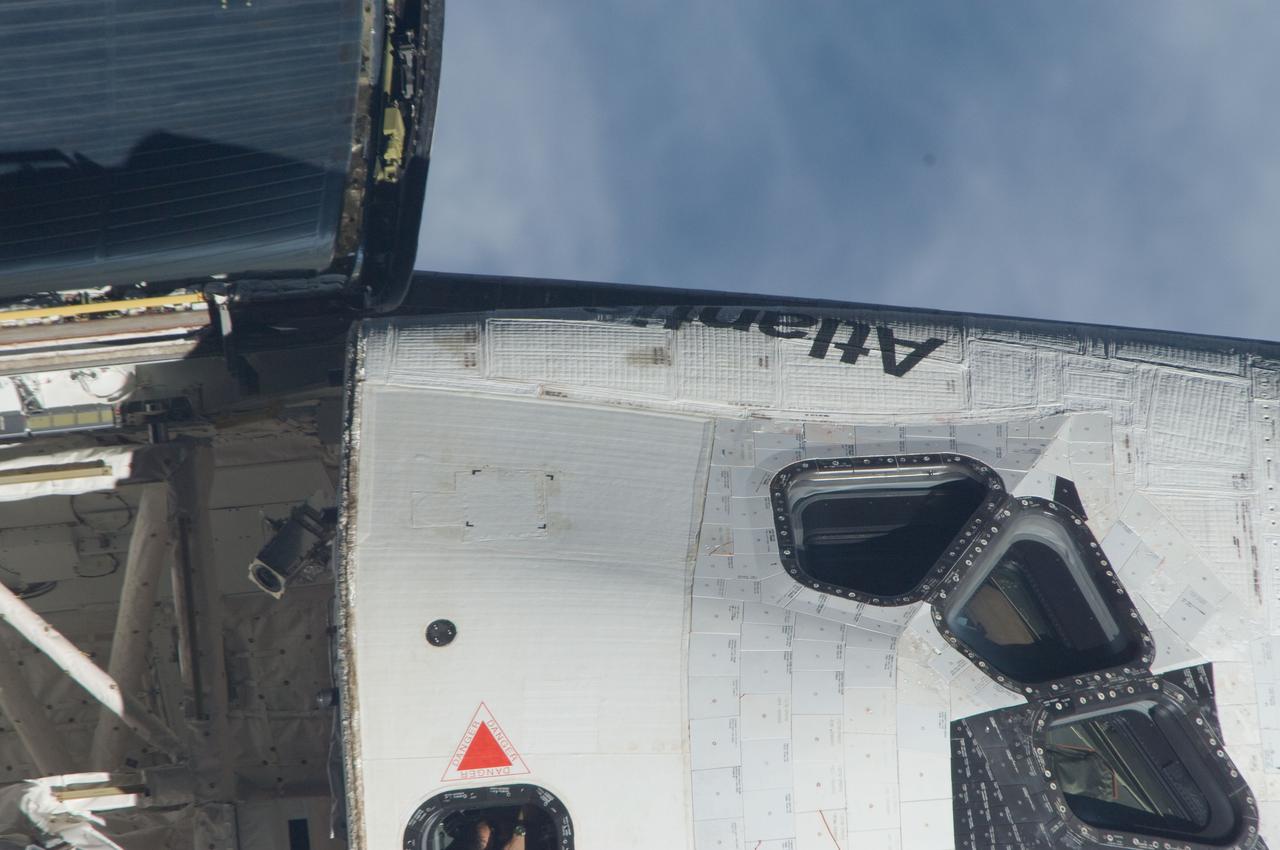 ISS028-E-015127 (10 July 2011) ---This is one of a series of images showing various parts of the space shuttle Atlantis in Earth orbit as photographed by one of the six crewmembers on the International Space Station as the shuttle “posed” for photo and visual surveys and performed a back-flip for the rendezvous pitch maneuver (RPM). An 800 millimeter lens was used to capture this particular series of images.