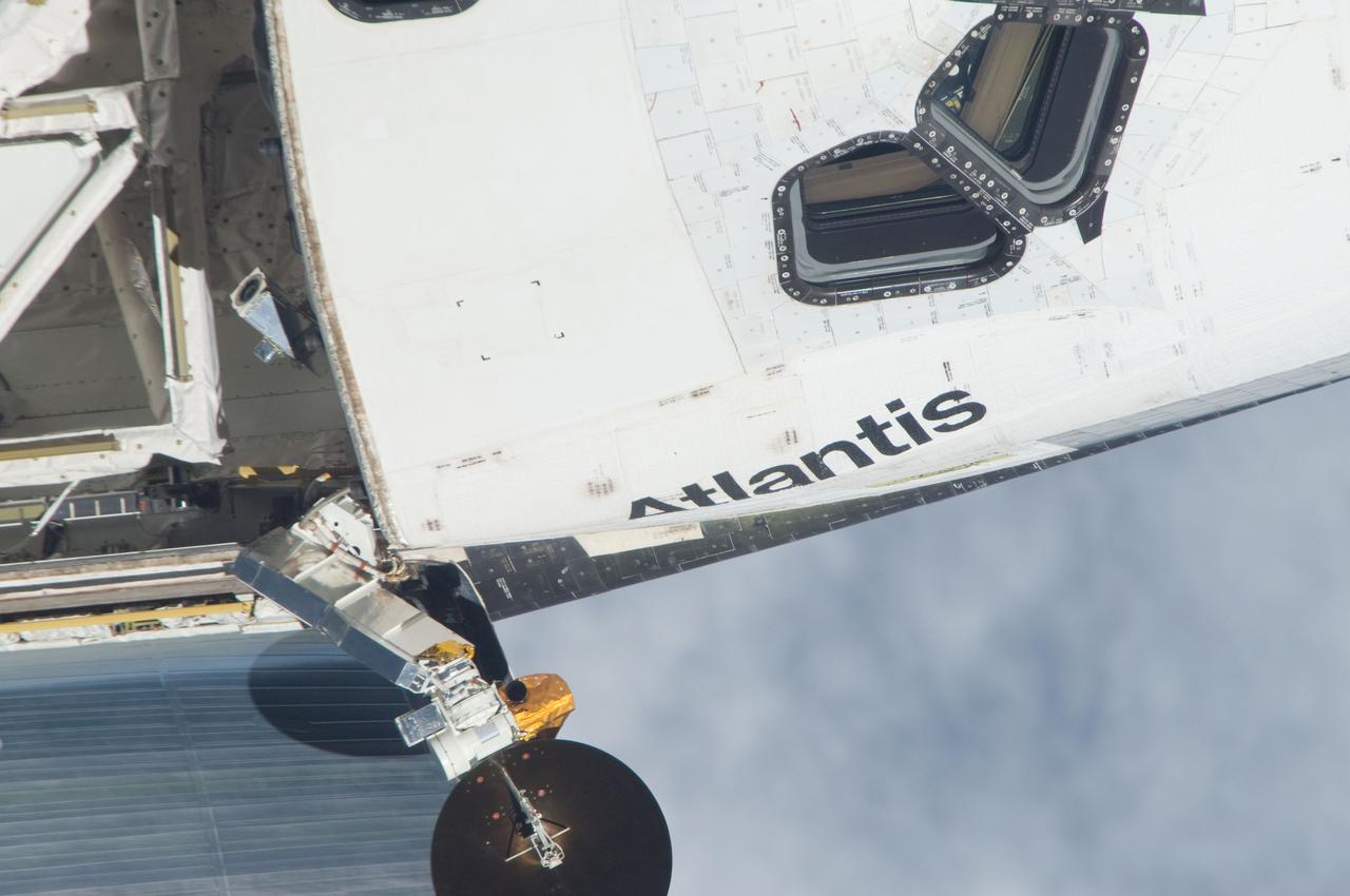 ISS028-E-015129 (10 July 2011) --- This is one of a series of images showing various parts of the space shuttle Atlantis in Earth orbit as photographed by one of the six crewmembers on the International Space Station as the shuttle “posed” for photo and visual surveys and performed a back-flip for the rendezvous pitch maneuver (RPM). An 800 millimeter lens was used to capture this particular series of images.