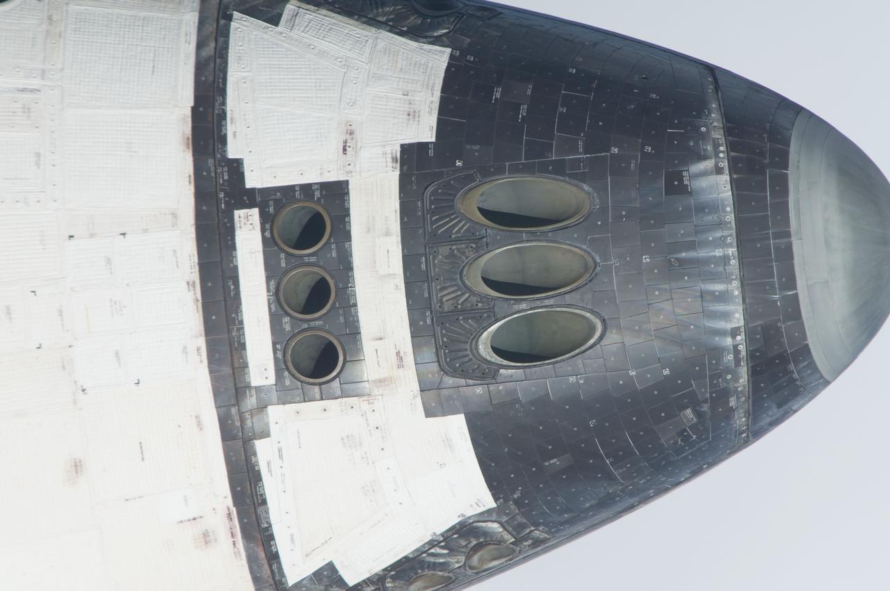 ISS028-E-015132 (10 July 2011) --- This is one of a series of images showing various parts of the space shuttle Atlantis in Earth orbit as photographed by one of the six crewmembers on the International Space Station as the shuttle “posed” for photo and visual surveys and performed a back-flip for the rendezvous pitch maneuver (RPM). An 800 millimeter lens was used to capture this particular series of images.