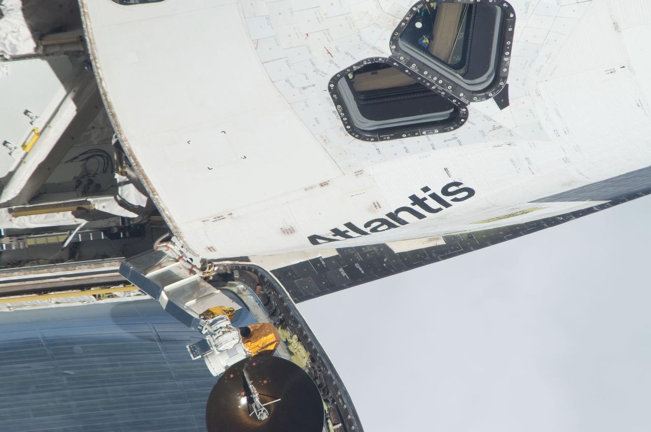 ISS028-E-015135 (10 July 2011) --- This is one of a series of images showing various parts of the space shuttle Atlantis in Earth orbit as photographed by one of the six crewmembers on the International Space Station as the shuttle “posed” for photo and visual surveys and performed a back-flip for the rendezvous pitch maneuver (RPM).  An 800 millimeter lens was used to capture this particular series of images.