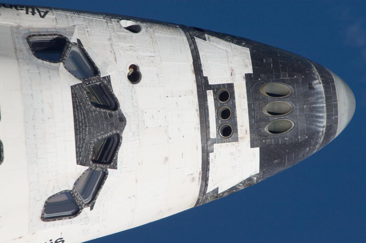 ISS028-E-015146 (10 July 2011) --- This is one of a series of images showing various parts of the space shuttle Atlantis in Earth orbit as photographed by one of the six crewmembers on the International Space Station as the shuttle “posed” for photo and visual surveys and performed a back-flip for the rendezvous pitch maneuver (RPM). An 800 millimeter lens was used to capture this particular series of images.