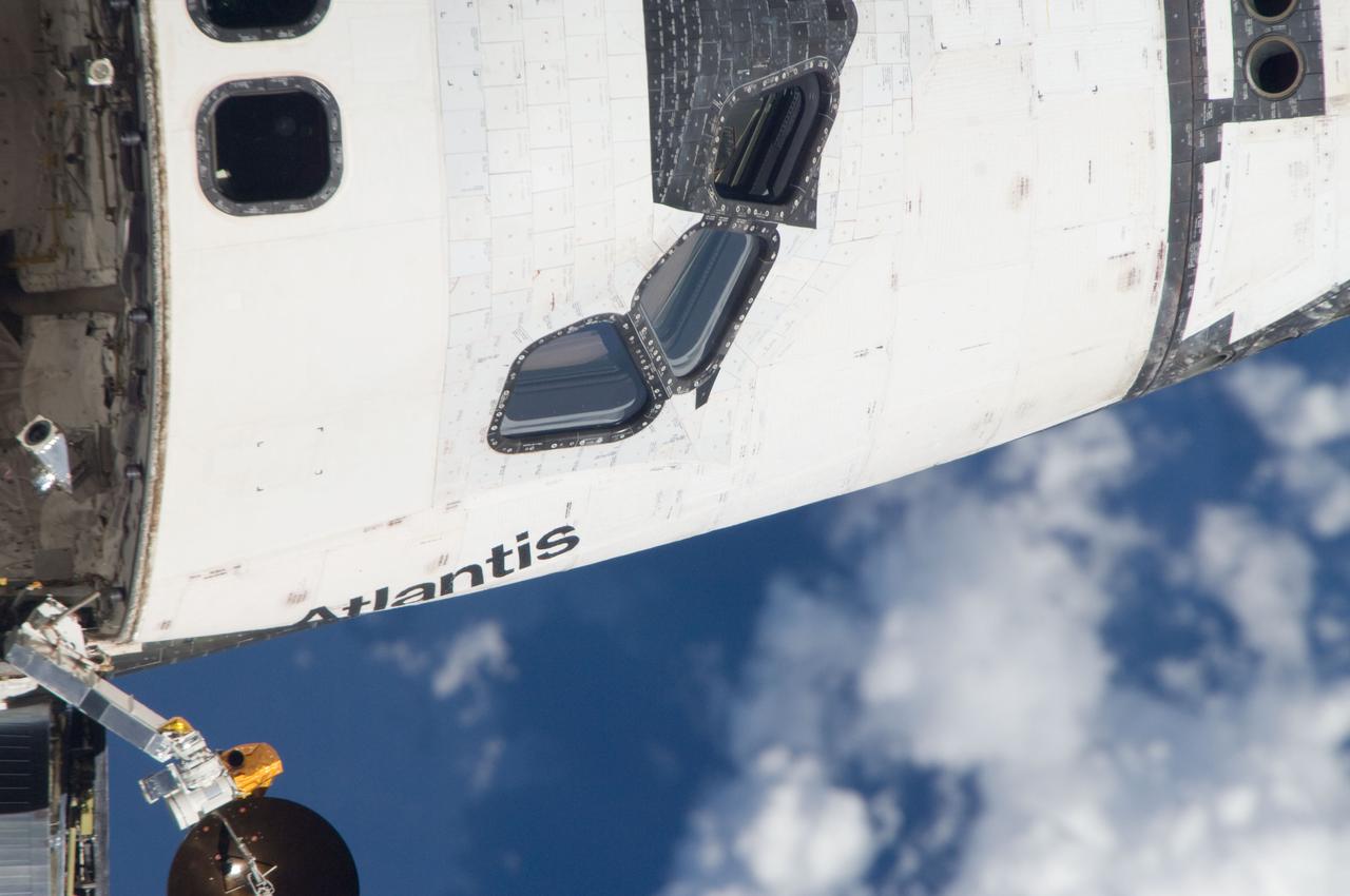 ISS028-E-015155 (10 July 2011) --- This is one of a series of images showing various parts of the space shuttle Atlantis in Earth orbit as photographed by one of the six crewmembers on the International Space Station as the shuttle “posed” for photo and visual surveys and performed a back-flip for the rendezvous pitch maneuver (RPM). An 800 millimeter lens was used to capture this particular series of images.