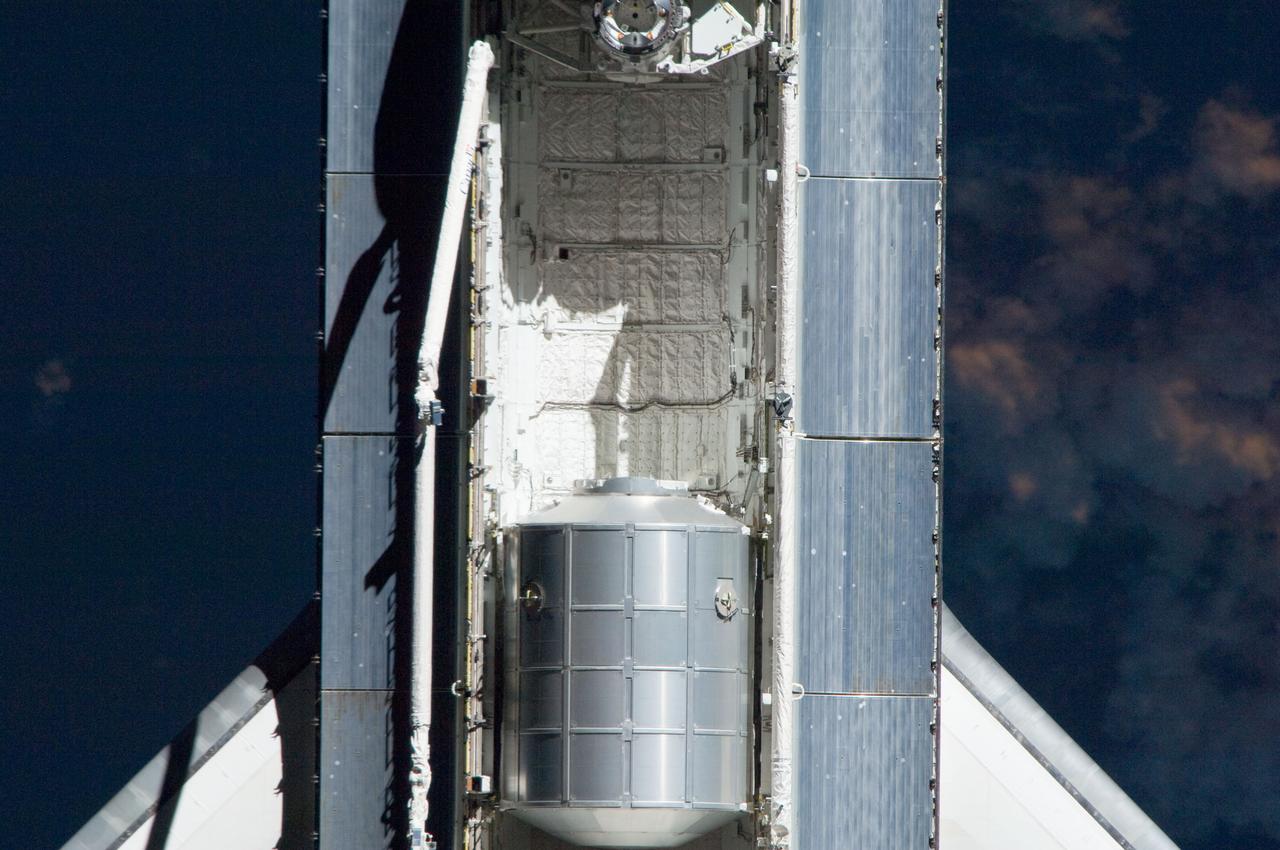 ISS028-E-015379 (10 July 2011) --- This is one of a series of images showing various parts of the space shuttle Atlantis in Earth orbit as photographed by one of three crew members -- half the station crew -- who were equipped with still cameras for this purpose on the International Space Station as the shuttle “posed” for photos and visual surveys and performed a back-flip for the rendezvous pitch maneuver (RPM). Seen at the rear of the cargo bay is the Raffaello multi-purpose logistics module, packed with supplies and spare parts for the orbiting outpost. An 800 millimeter lens was used to capture this particular series of images.