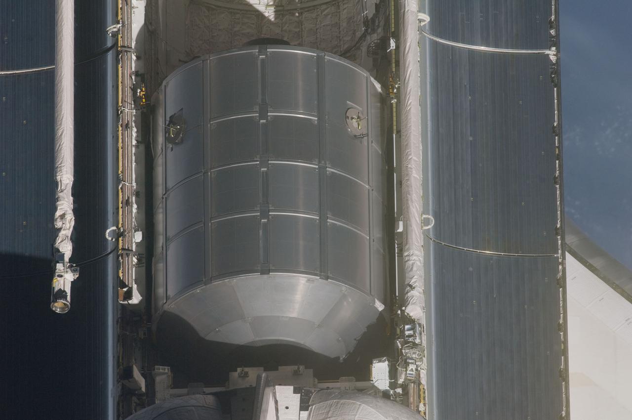 ISS028-E-015518 (10 July 2011) --- A nadir view of the space shuttle Atlantis' payload bay was provided by one of a series of images showing various parts of the shuttle in Earth orbit. Seen at the rear of the cargo bay is the Raffaello multi-purpose logistics module, packed with supplies and spare parts for the International Space Station. The series was photographed by one of three crewmembers -- half the station crew -- who were equipped with still cameras on the orbiting outpost as the shuttle “posed” for photos and visual surveys and performed a back-flip for the rendezvous pitch maneuver (RPM).  A 400 millimeter lens was used to capture this particular series of images.