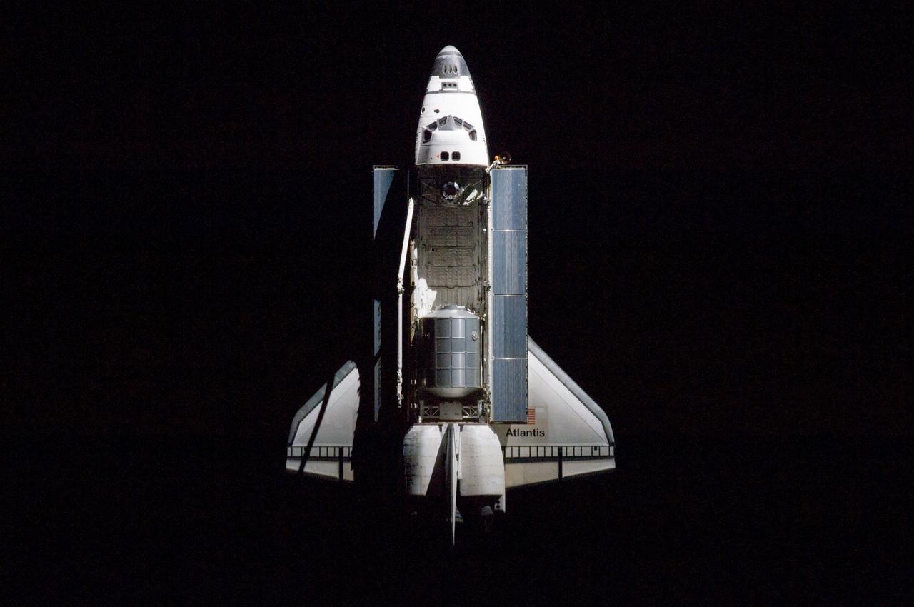 ISS028-E-015553 (10 July 2011) --- A nadir view of the space shuttle Atlantis and its payload was provided by one of a series of images showing various parts of the shuttle in Earth orbit. Seen at the rear of the cargo bay is the Raffaello multi-purpose logistics module, packed with supplies and spare parts for the International Space Station. The series was photographed by one of three crewmembers -- half the station crew -- who were equipped with still cameras on the orbiting outpost as the shuttle “posed” for photos and visual surveys and performed a back-flip for the rendezvous pitch maneuver (RPM). A 400 millimeter lens was used to capture this particular series of images.