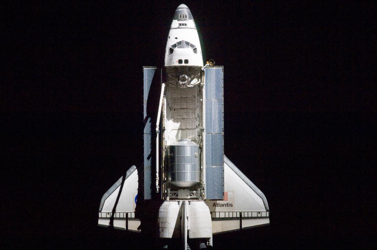 ISS028-E-015556 (10 July 2011) --- A nadir view of the space shuttle Atlantis and its payload was provided by one of a series of images showing various parts of the shuttle in Earth orbit. Seen at the rear of the cargo bay is the Raffaello multi-purpose logistics module, packed with supplies and spare parts for the International Space Station. The series was photographed by one of three crewmembers -- half the station crew -- who were equipped with still cameras on the orbiting outpost as the shuttle “posed” for photos and visual surveys and performed a back-flip for the rendezvous pitch maneuver (RPM). A 400 millimeter lens was used to capture this particular series of images.