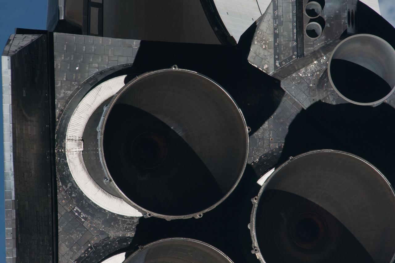 ISS028-E-015588 (10 July 2011) --- This picture of Atlantis' main and subsystem engines is one of a series of images showing various parts of the space shuttle Atlantis in Earth orbit as photographed by one of three crew members -- half the station crew -- who were equipped with still cameras for this purpose on the International Space Station as the shuttle “posed” for photos and visual surveys and performed a back-flip for the rendezvous pitch maneuver (RPM). A 1000 millimeter lens was used to capture this particular series of images.