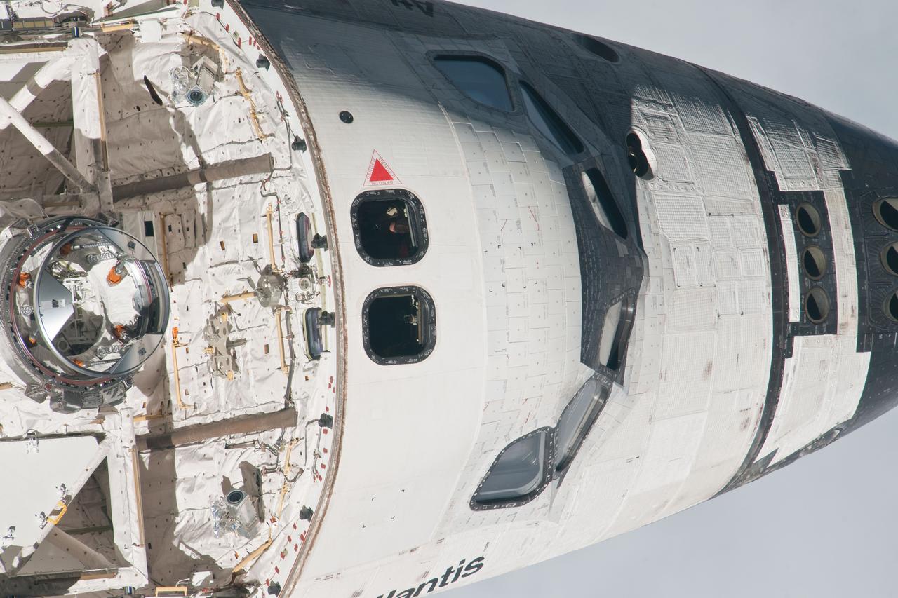 ISS028-E-015593  (10 July 2011) --- This is one of a series of images showing various parts of the space shuttle Atlantis in Earth orbit as photographed by one of three crew members -- half the station crew -- who were equipped with still cameras for this purpose on the International Space Station as the shuttle “posed” for photos and visual surveys and performed a back-flip for the rendezvous pitch maneuver (RPM).  A  1000 millimeter lens was used to capture this particular series of images.