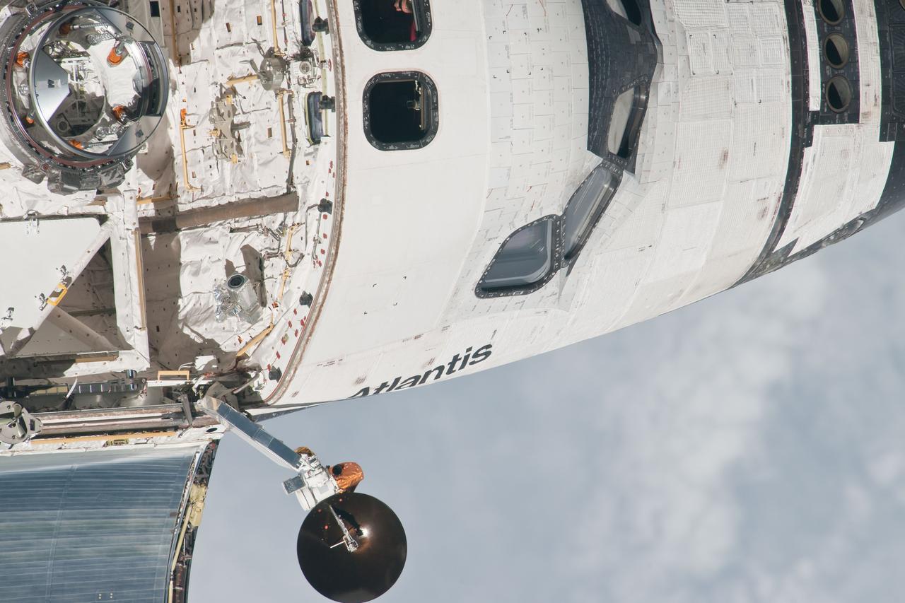 ISS028-E-015594 (10 July 2011) --- This is one of a series of images showing various parts of the space shuttle Atlantis in Earth orbit as photographed by one of three crew members -- half the station crew -- who were equipped with still cameras for this purpose on the International Space Station as the shuttle “posed” for photos and visual surveys and performed a back-flip for the rendezvous pitch maneuver (RPM). A  1000 millimeter lens was used to capture this particular series of images.