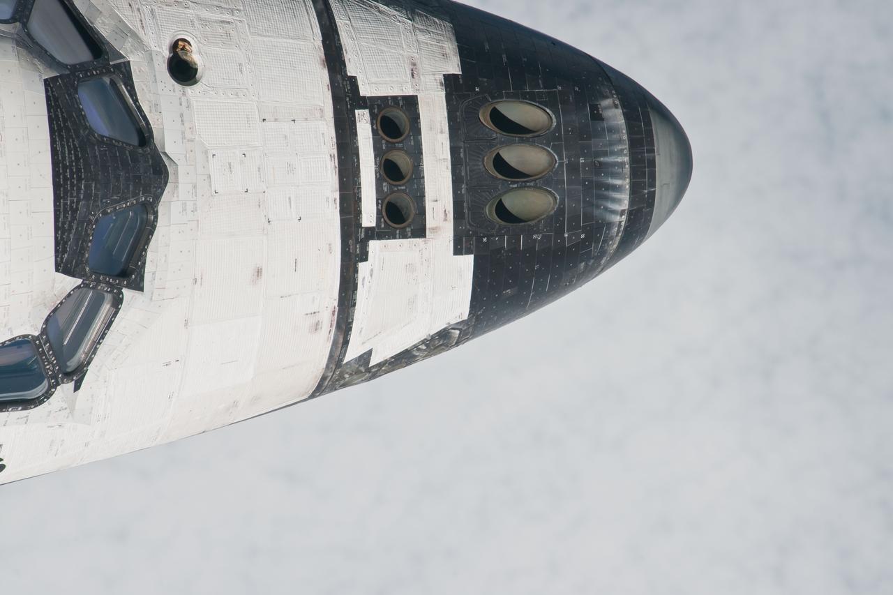 ISS028-E-015599  (10 July 2011) --- This is one of a series of images showing various parts of the space shuttle Atlantis in Earth orbit as photographed by one of three crew members -- half the station crew -- who were equipped with still cameras for this purpose on the International Space Station as the shuttle “posed” for photos and visual surveys and performed a back-flip for the rendezvous pitch maneuver (RPM).  A  1000 millimeter lens was used to capture this particular series of images.