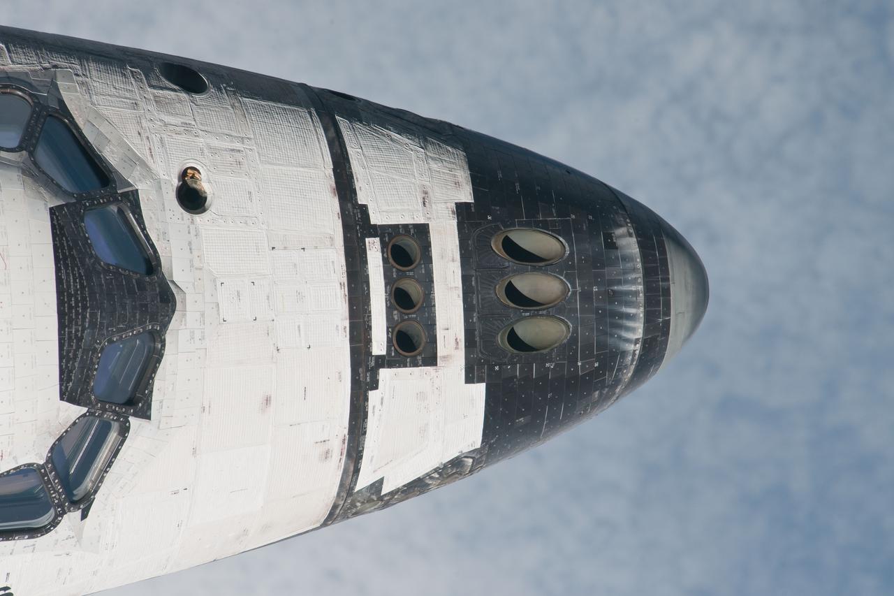 ISS028-E-015600  (10 July 2011) --- This is one of a series of images showing various parts of the space shuttle Atlantis in Earth orbit as photographed by one of three crew members -- half the station crew -- who were equipped with still cameras for this purpose on the International Space Station as the shuttle “posed” for photos and visual surveys and performed a back-flip for the rendezvous pitch maneuver (RPM).  A  1000 millimeter lens was used to capture this particular series of images.