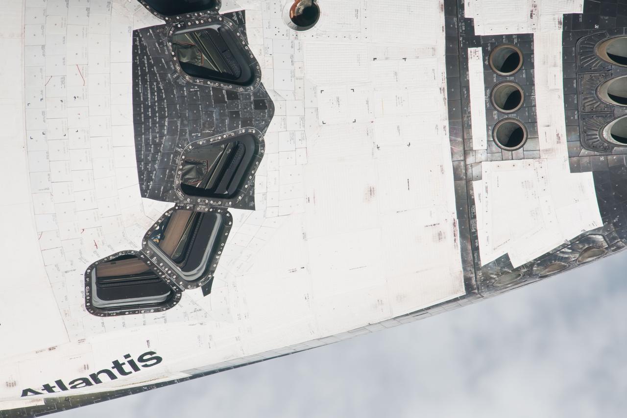 ISS028-E-015659 (10 July 2011) --- This is one of a series of images showing various parts of the space shuttle Atlantis in Earth orbit as photographed by one of three crew members -- half the station crew -- who were equipped with still cameras for this purpose on the International Space Station as the shuttle “posed” for photos and visual surveys and performed a back-flip for the rendezvous pitch maneuver (RPM). A 1000 millimeter lens was used to capture this particular series of images.