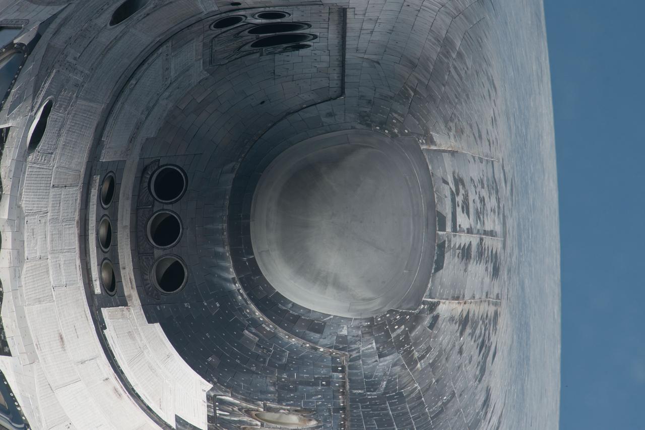 ISS028-E-015671 (10 July 2011) --- This head-on picture of Atlantis' nose and part of the underside's thermal protective system tiles is one of a series of images showing various parts of the shuttle in Earth orbit as photographed by one of three crew members -- half the station crew -- who were equipped with still cameras for this purpose on the International Space Station as the shuttle “posed” for photos and visual surveys and performed a back-flip for the rendezvous pitch maneuver (RPM). A  1000 millimeter lens was used to capture this particular series of images.
