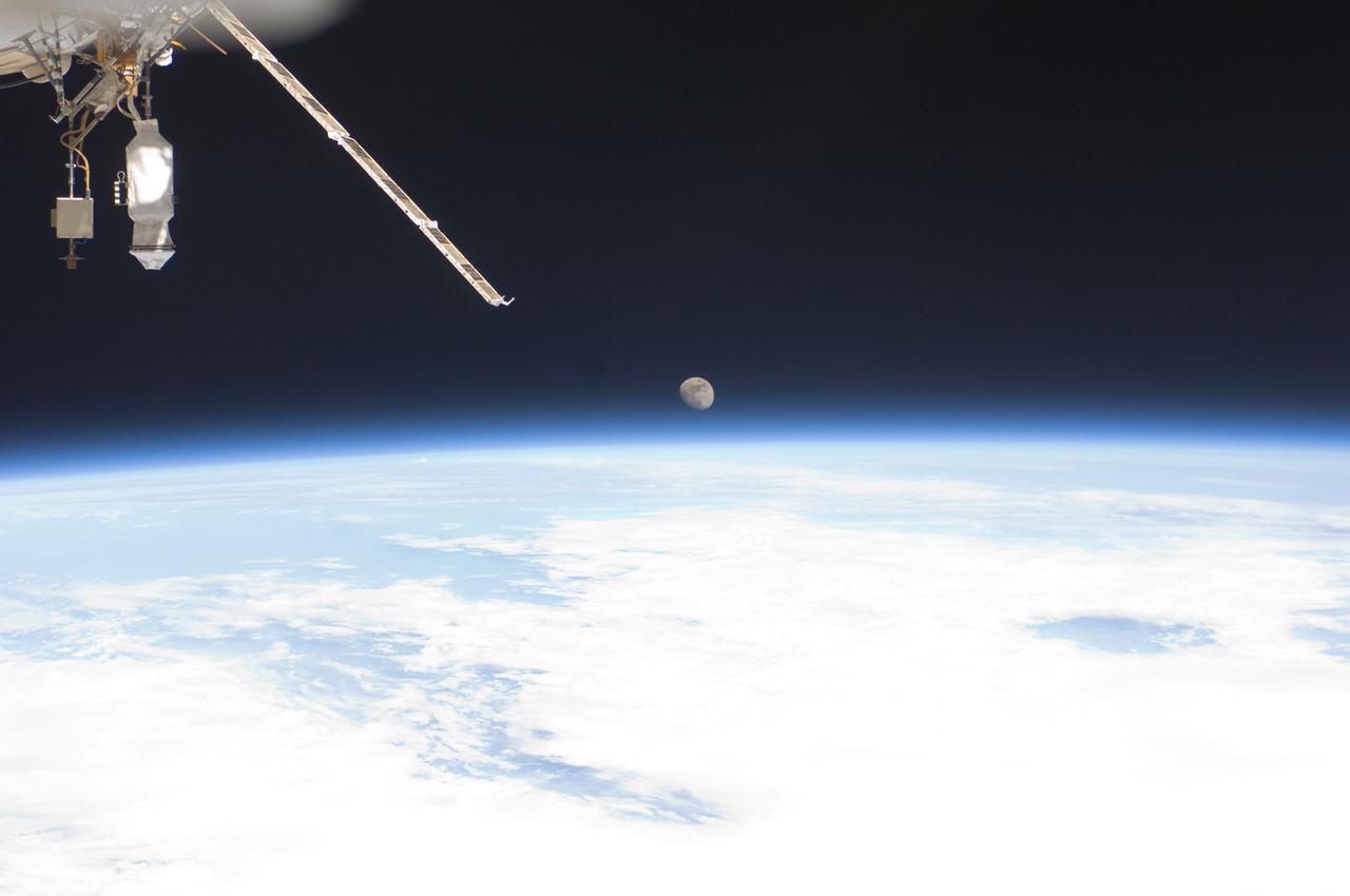 ISS028-E-016056 (12 July 2011) --- One of the Expedition 28 crewmembers aboard the International Space Station recorded this image of Earth's horizon and the moon during the week and a half period that the orbiting complex was hosting Atlantis and its crew for the final Space Shuttle Program mission.