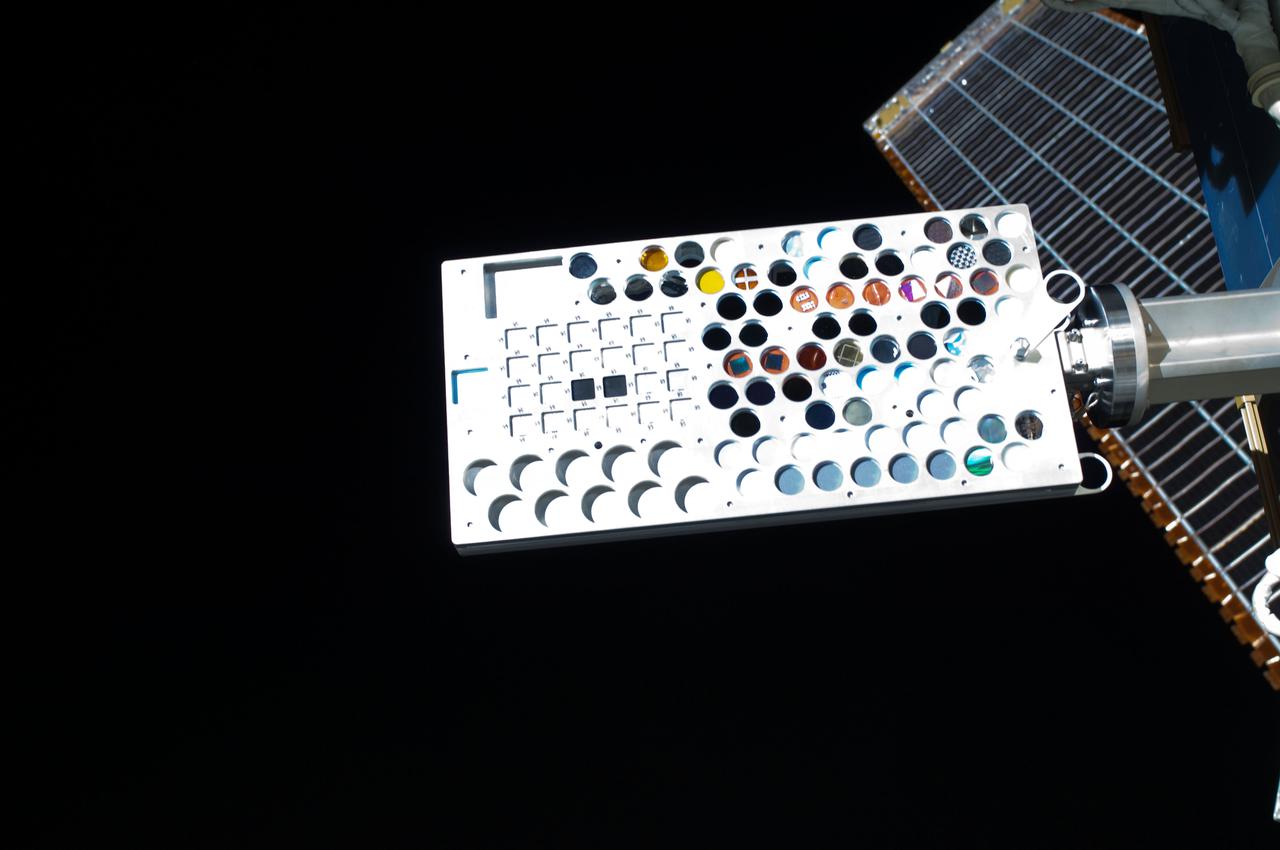 ISS028-E-016111 (12 July 2011) --- This close-up image, recorded during a July 12 spacewalk, shows the Materials on International Space Station Experiment - 8 (MISSE-8).  The experiment package is a test bed for materials and computing elements attached to the outside of the orbiting complex. These materials and computing elements are being evaluated for the effects of atomic oxygen, ultraviolet, direct sunlight, radiation, and extremes of heat and cold. This experiment allows the development and testing of new materials and computing elements that can better withstand the rigors of space environments. Results will provide a better understanding of the durability of various materials and computing elements when they are exposed to the space environment, with applications in the design of future spacecraft.