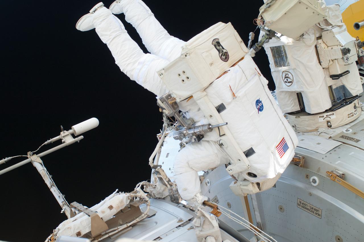 ISS028-E-016148 (12 July 2011) --- NASA astronaut Ron Garan, Expedition 28 flight engineer, is pictured in the International Space Station's Quest airlock prior to a July 12 spacewalk he performed outside the docked station and space shuttle Atlantis with station crewmate Mike Fossum (out of frame). NASA astronauts Garan and Fossum a short time later joined forces to complete some needed chores during the six and half hour spacewalk.