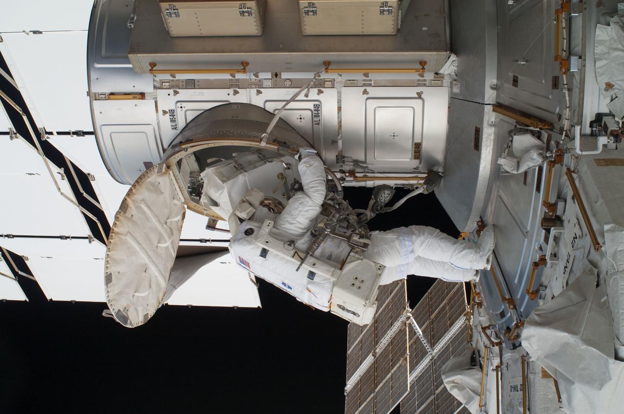 ISS028-E-016253 (12 July 2011) --- NASA astronaut Ron Garan, Expedition 28 flight engineer, egresses the Quest airlock on the International Space Station as he prepares to join crewmate Mike Fossum on a July 12 spacewalk.