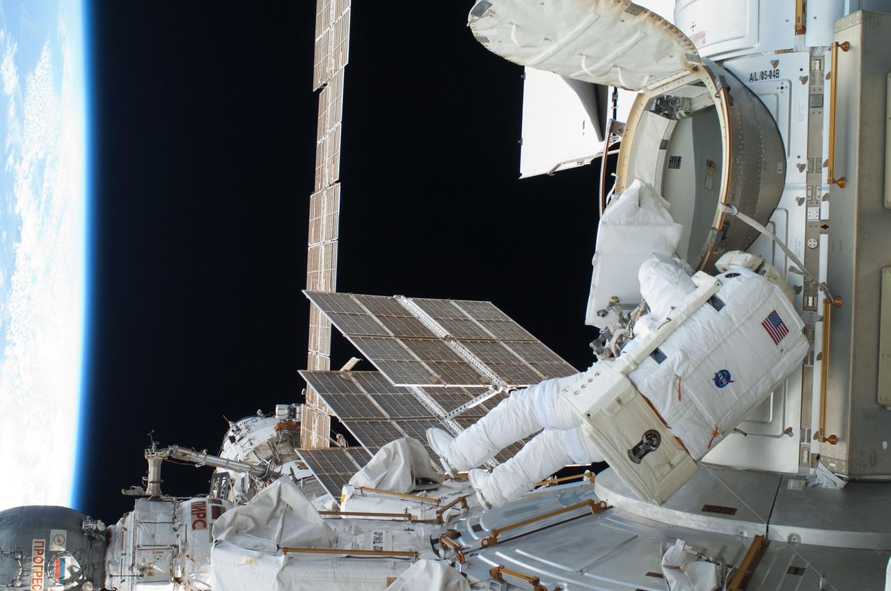 ISS028-E-016265 (12 July 2011) --- NASA astronaut Ron Garan, Expedition 28 flight engineer, egresses the Quest airlock on the International Space Station as he prepares to join crewmate Mike Fossum on a July 12 spacewalk.