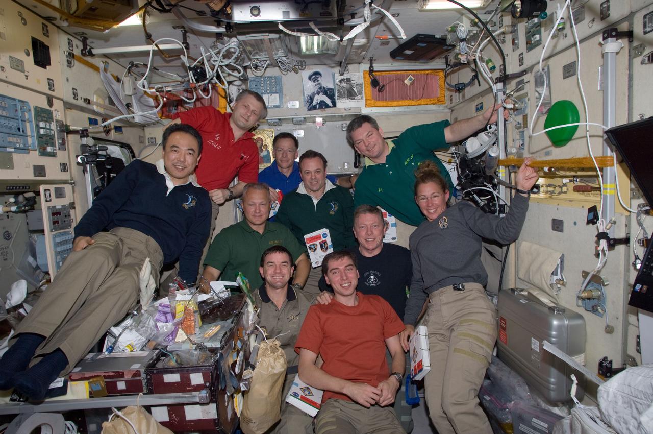ISS028-E-016779 (16 July 2011)--- Inside the Zvezda service module on the International Space Station, space shuttle Atlantis and station crewmembers take a break from an extremely busy work agenda for photos and a social period. Not much time remains for such reunions, as undocking and separation activities are scheduled for a little over 48 hours from the time this photo was made. The STS-135 crew consists of NASA astronauts Chris Ferguson, Doug Hurley, Sandy Magnus and Rex Walheim; the Expedition 28 or station crew members are JAXA astronaut Satoshi Furukawa, NASA astronauts Ron Garan and Mike Fossum, and Russian cosmonauts Andrey Borisenko, Alexander Samokutyaev and Sergei Volkov.