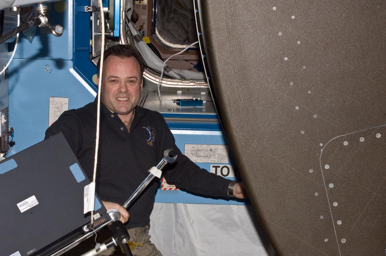 ISS028-E-017363 (17 July 2011) --- NASA astronaut Ron Garan, Expedition 28 flight engineer, works with a pulled rack in the U.S. lab or Destinty aboard the Internatinal Space Station.