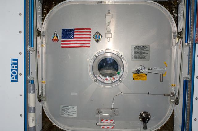 NASA image: American Flag mounted to Node 2 Forward Hatch