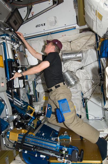 NASA image: FE Fossum performs aRED In-Flight Maintenance