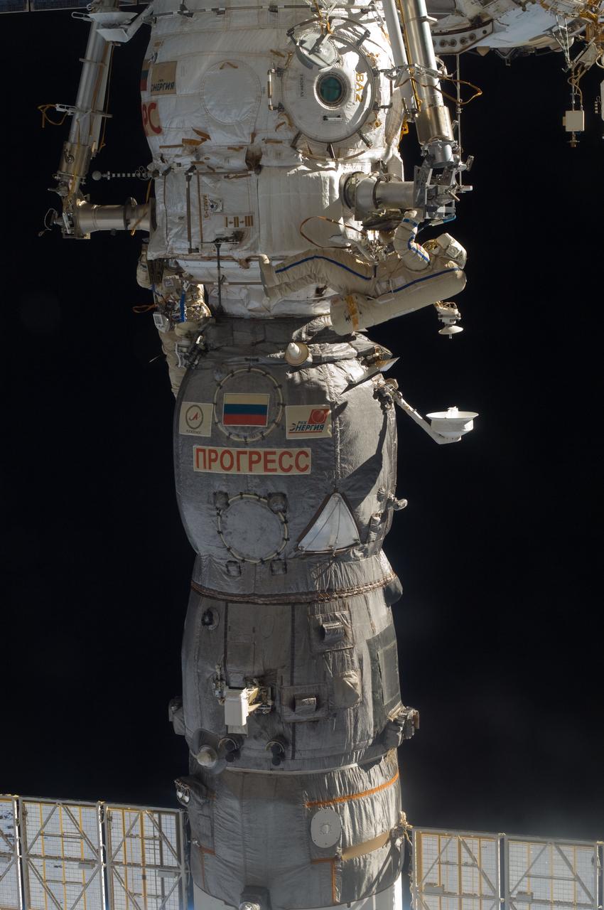 ISS028-E-020965 (3 Aug. 2011) --- Russian cosmonauts Sergei Volkov and Alexander Samokutyaev (out of frame), both Expedition 28 flight engineers, attired in Russian Orlan spacesuits, participate in a session of extravehicular activity (EVA) on the Russian segment of the International Space Station. During the six-hour, 23-minute spacewalk, Volkov and Samokutyaev moved a cargo boom from one airlock to another, installed a prototype laser communications system and deployed an amateur radio micro-satellite.