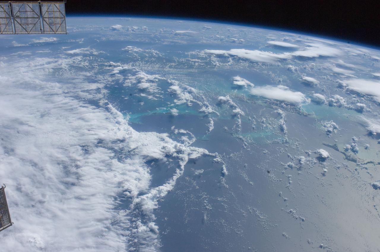 ISS028-E-030243 (23 Aug. 2011) --- A digital photo from the International Space Station from Aug. 23, 2011, allows the viewer to look toward the southwest at part of Hurricane Irene churning near the northern Bahamas, including Great Abaco Island (lower right), Andros Island under a thunderstorm (center right) and a ?fair? Cuba from left to right (upper center). The outflow and some of the banding of the northwest side of Irene are visible on the lower left. Meteorologists say Irene probably was centered over Acklins Island packing 120 mile per hour winds when the photo was taken.