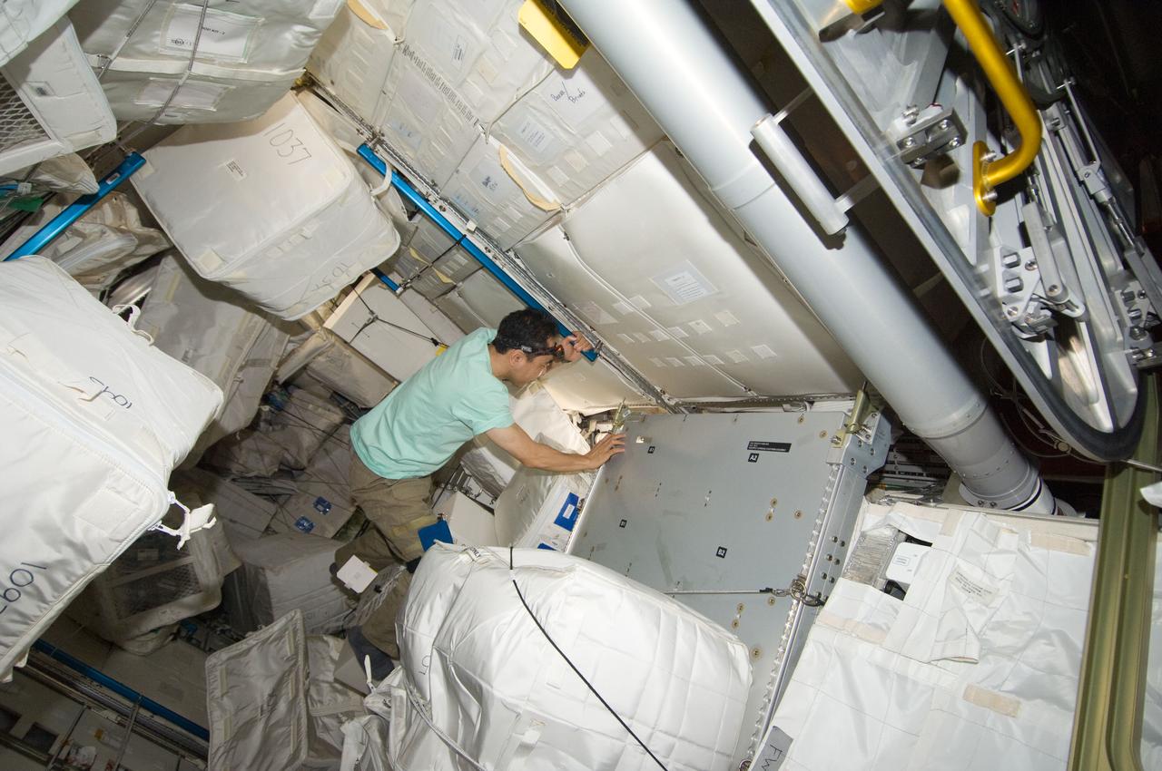 ISS028-E-032130 (17 Aug. 2011) --- Japan Aerospace Exploration Agency astronaut Satoshi Furukawa, Expedition 28 flight engineer, works in the Leonardo Permanent Multipurpose Module (PMM) of the International Space Station.
