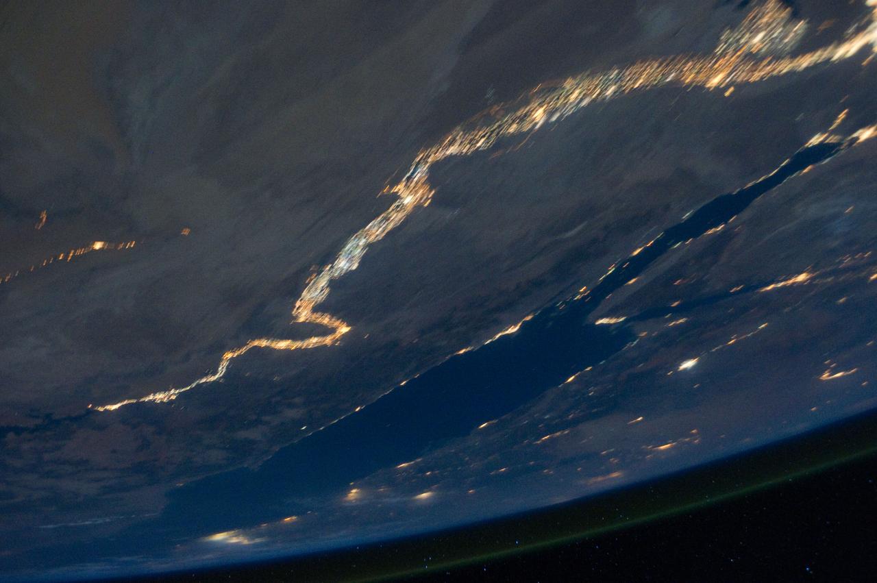 ISS028-E-033124 (18 Aug. 2011) --- The Nile River and the Sinai Peninsula can be easily delineated in this night time photo captured by one of the Expedition 28 crew members aboard the International Space Station, flying at an altitude of approximately 220 miles. A 42-mm focal length was used to record the image.