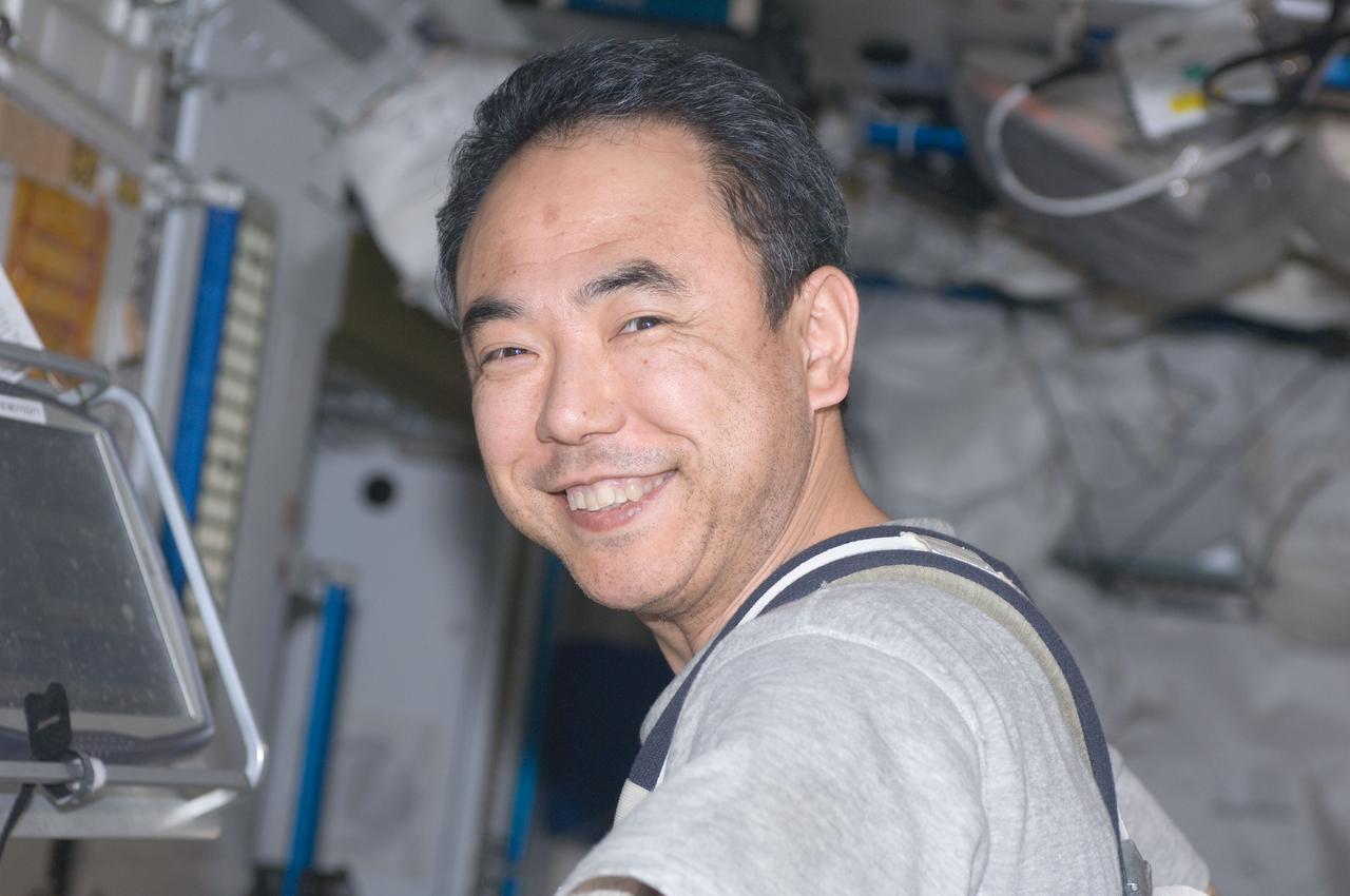 ISS028-E-034129 (26 Aug. 2011) --- Japan Aerospace Exploration Agency astronaut Satoshi Furukawa, Expedition 28 flight engineer, smiles for a close-up photo while exercising on the Combined Operational Load Bearing External Resistance Treadmill (COLBERT) in the Tranquility node of the International Space Station.