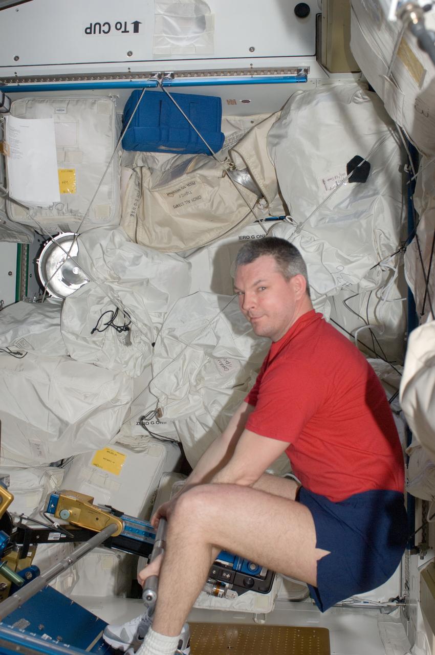 ISS028-E-034974 (30 Aug. 2011) --- Russian cosmonaut Alexander Samokutyaev, Expedition 28 flight engineer, exercises using the advanced Resistive Exercise Device (aRED) in the Tranquility node of the International Space Station.