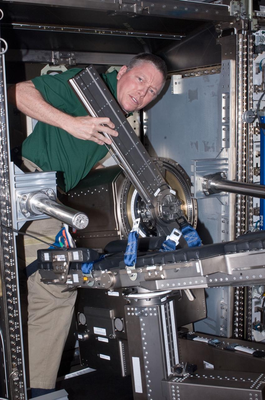 ISS028-E-035301 (31 Aug. 2011) --- NASA astronaut Mike Fossum, Expedition 28 flight engineer, works with Muscle Atrophy Research & Exercise System (MARES) hardware in the Columbus laboratory of the International Space Station.