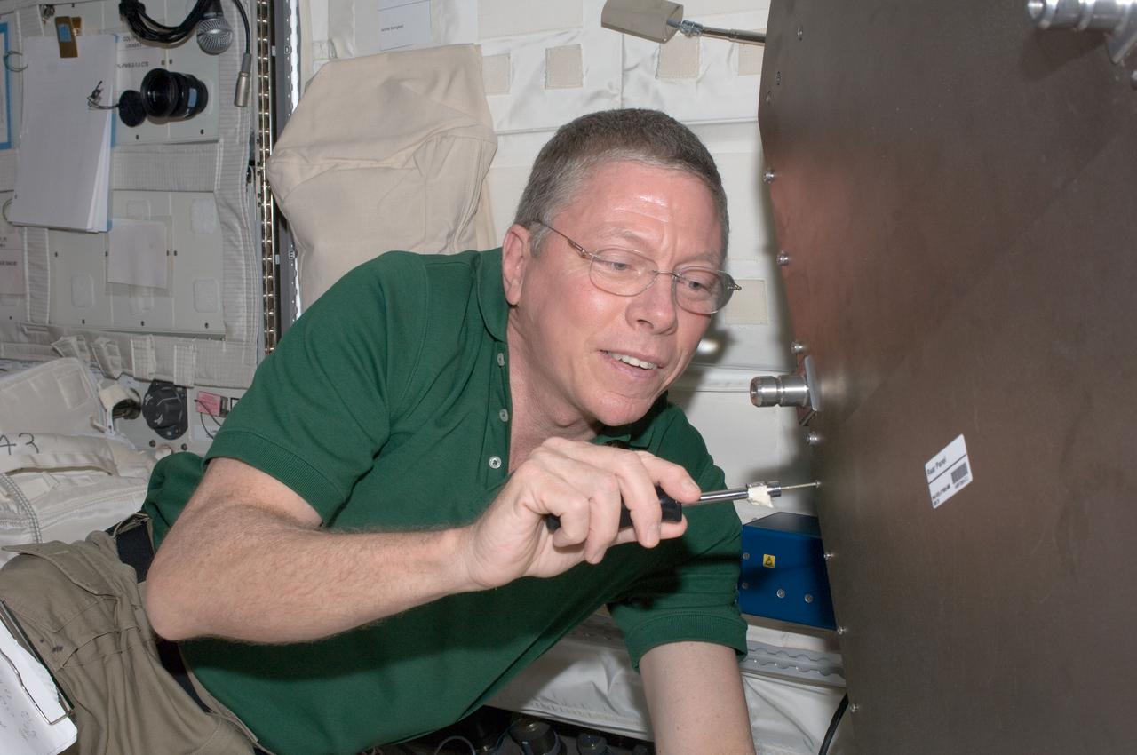 ISS028-E-035603 (31 Aug. 2011) --- NASA astronaut Mike Fossum, Expedition 28 flight engineer, works with Muscle Atrophy Research & Exercise System (MARES) hardware in the Columbus laboratory of the International Space Station.