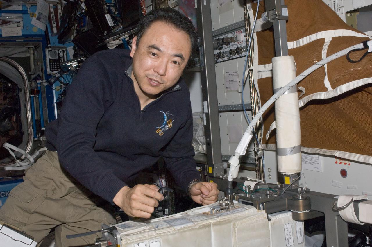 ISS028-E-036696 (2 Sept. 2011) --- Japan Aerospace Exploration Agency astronaut Satoshi Furukawa, Expedition 28 flight engineer, performs a periodic calibration of the pedals for the Cycle Ergometer with Vibration Isolation System (CEVIS) in the Destiny laboratory of the International Space Station.