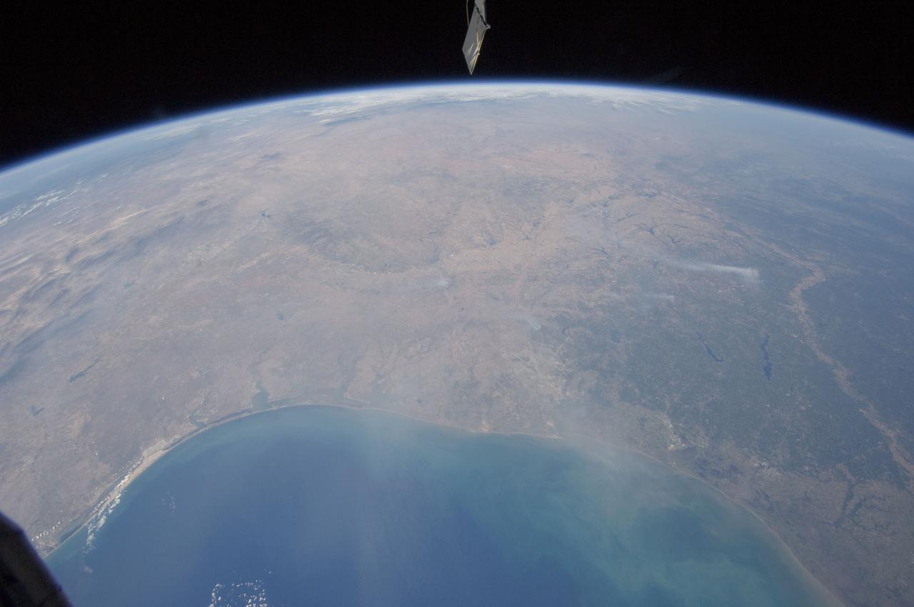 ISS028-E-037977 (6 Sept. 2011) ---  The Texas  wild fires that have destroyed and continue to destroy thousands of acres of timber and prairie land, as well as hundreds of residences, are visible basically over many of the dozens of affected points across the nation's second largest state. The Expedition 28 crew members on the International Space Station, flying approximately 220 miles above Earth, recorded this wide panoramic image of Texas and beyond, from a point over the Gulf of Mexico, at 16:11:22 GMT, Sept. 6, 2011.