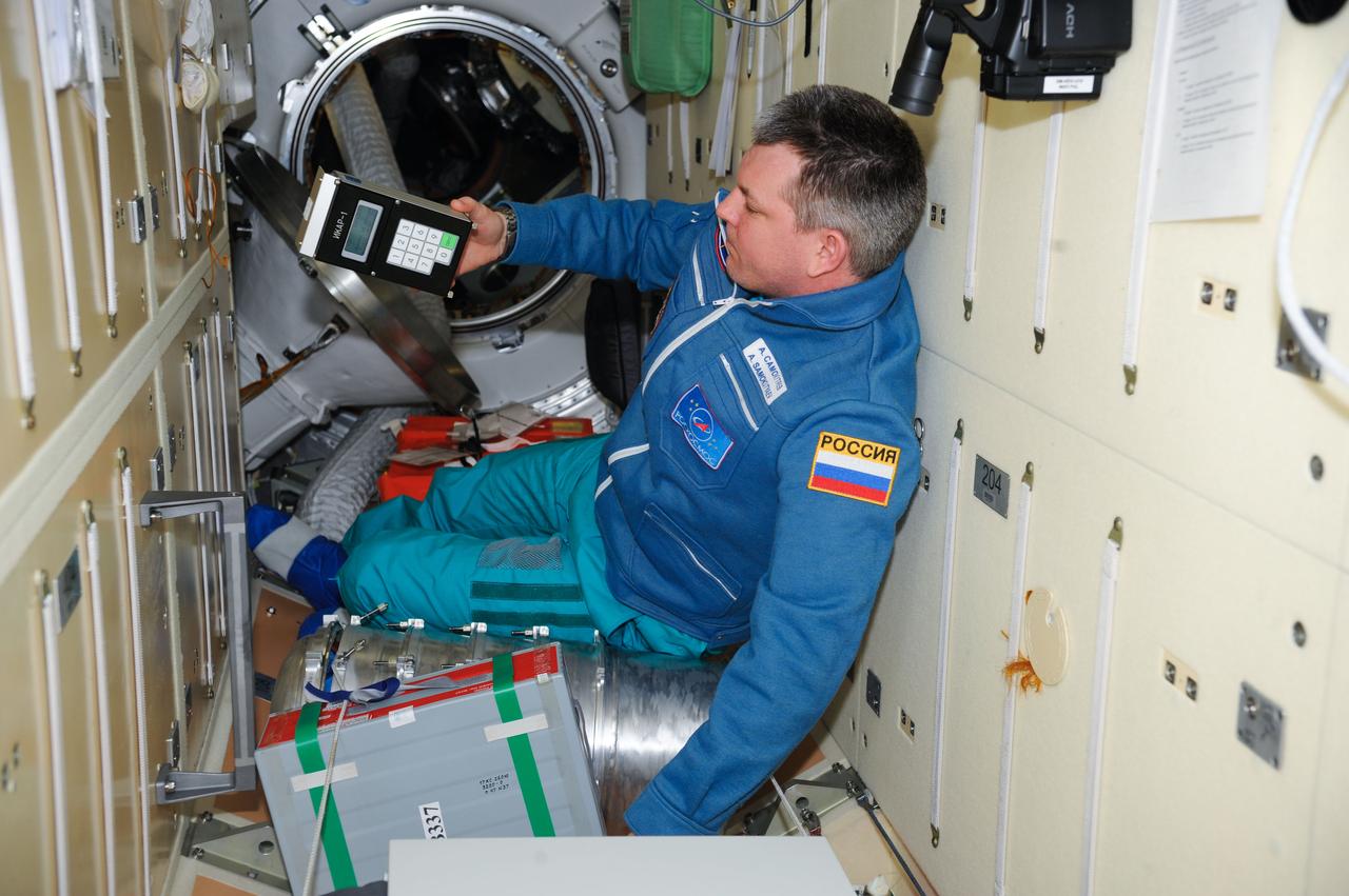 ISS028-E-041287 (7 Sept. 2011) --- Russian cosmonaut Alexander Samokutyaev, Expedition 28 flight engineer, uses the Russian Tekh-38 VETEROK ("Breeze") science hardware to take aero-ionic concentration measurements in the Rassvet Mini-Research Module 1 (MRM1) of the International Space Station.