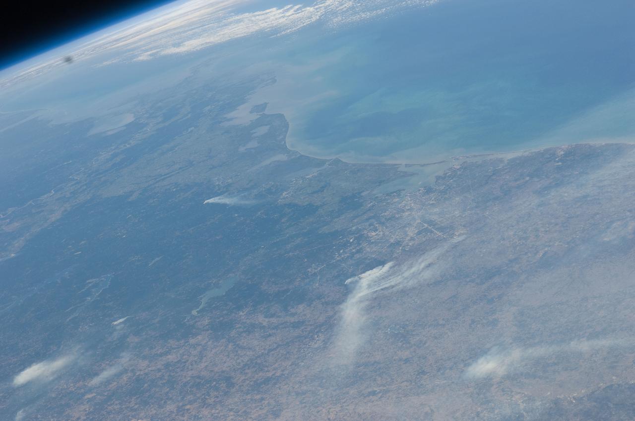 ISS028-E-043559 (7 Sept. 2011) --- This view, from the camera of an Expedition 28 crew member onboard the International Space Station, looks from the northwest toward southeast and covers many counties in southeast Texas that have been heavily affected by dozens of wild fires. Houston can be seen near frame center and the Gulf of Mexico takes up the upper right quadrant of the frame.