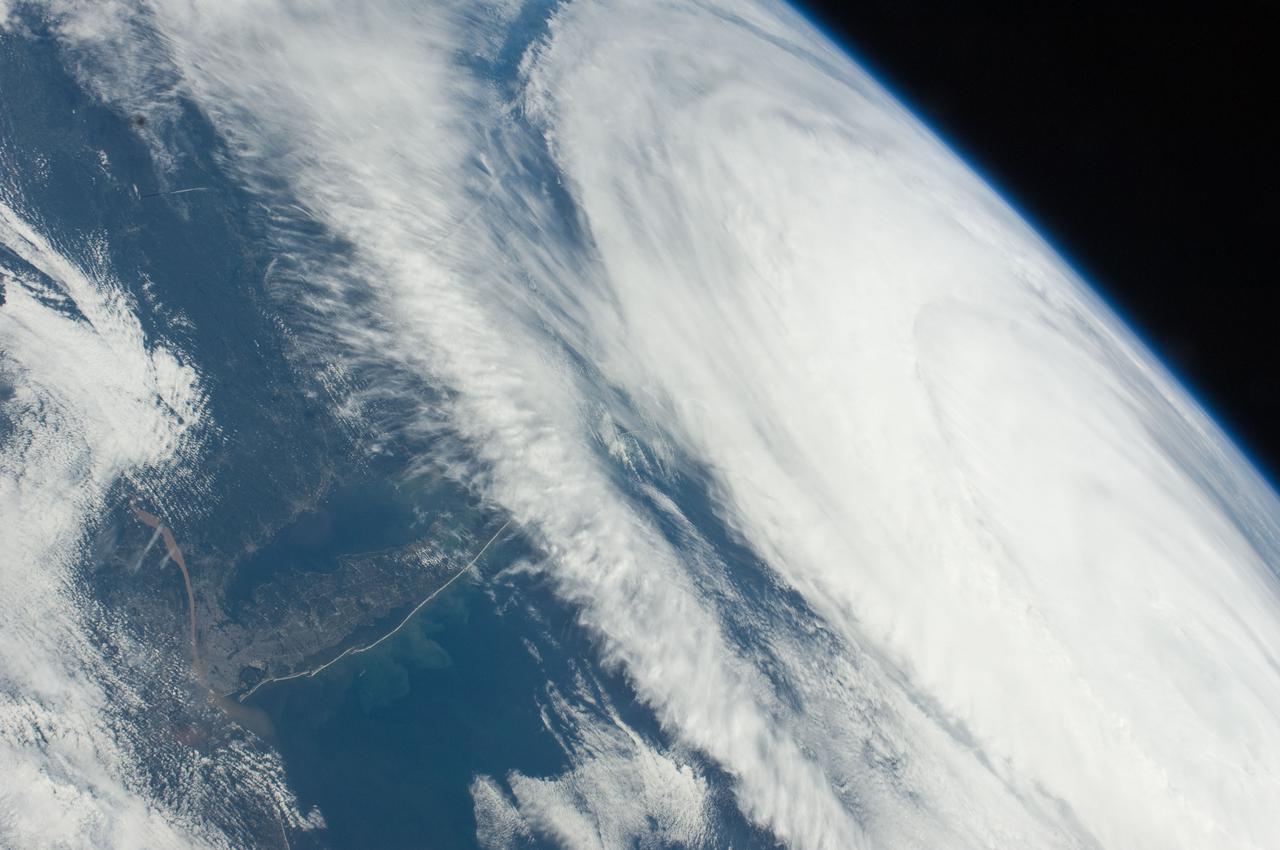 ISS028-E-045516 (9 Sept. 2011) --- Hurricane Katia off the northeastern USA coastline is featured in this image photographed by an Expedition 28 crew member on the International Space Station. Hurricane Katia had diminished to Category 1 strength on the Saffir-Simpson scale at the time this photograph was taken, but it still presented an impressive cloud circulation as its center passed by the northeastern USA coastline on Sept. 9, 2011. The storm had reached Category 4 strength earlier on Sept. 5, making it the second major hurricane of the 2011 Atlantic hurricane season. Katia remained over open waters of the Atlantic Ocean during its lifetime, unlike two preceding storms of the season ? Hurricane Irene and Tropical Storm Lee ? both of which made landfall on the continental USA. The approximate center of Hurricane Katia is visible at lower right, with its outer cloud bands extending across the center of the view. A small part of the State of New York ? including Long Island and the Hudson River ? is visible through a gap in the cloud cover at lower left. The Hudson River has a chocolate brown coloration due to heavy loading with sediment, a consequence of flooding and erosion of the upstream watershed from the heavy precipitation of Hurricane Irene and Tropical Storm Lee. A plume of sediment is just visible entering the Atlantic Ocean on the southern coastline of Long Island, directly to the south of the New York City metropolitan area (partially obscured by clouds). Crew members on the International Space Station have the opportunity to take images like this one by looking outwards at an angle through space station windows, much like taking photographs of the ground from a commercial airliner window ? albeit from an average altitude of approximately 400 kilometers.